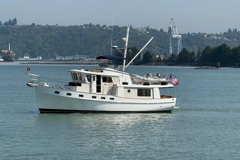 Yacht Photos Pics 1998 Kadey-Krogen 48' Northsea Widebody Pilothouse yacht on calm water.
