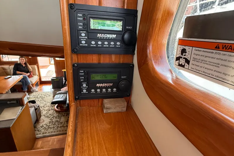  Yacht Photos Pics Interior of 1998 Kadey-Krogen 48' Northsea Pilothouse with control panels and warning sign.