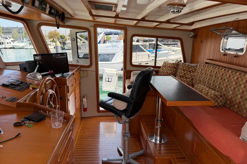  Yacht Photos Pics 1998 Kadey-Krogen 48' Northsea Widebody Pilothouse interior with helm, seating, and table.