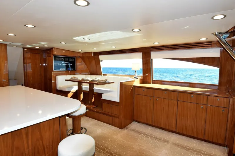 Party Of Five Yacht Photos Pics Luxurious interior of 2019 Viking 80 Sky Bridge yacht with ocean view.