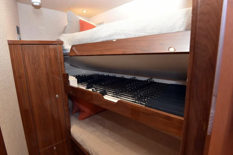 Party Of Five Yacht Photos Pics Bunk beds with storage in 2019 Viking 80 Sky Bridge yacht interior.