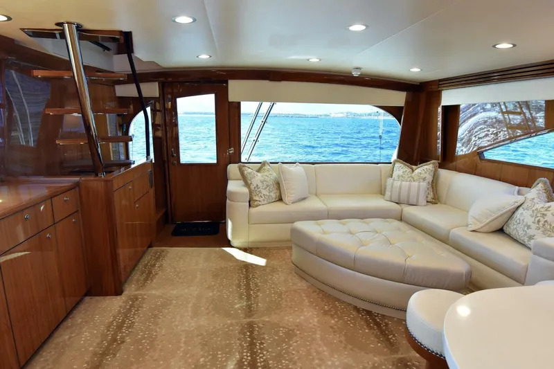 Party Of Five Yacht Photos Pics Luxurious interior of 2019 Viking 80 Sky Bridge yacht with elegant seating and ocean view.