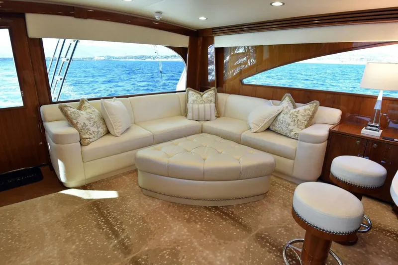 Party Of Five Yacht Photos Pics Luxurious interior of 2019 Viking 80 Sky Bridge yacht with elegant seating and ocean view.