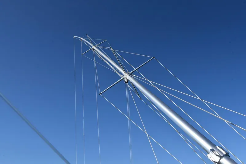 Party Of Five Yacht Photos Pics Mast of 2019 Viking 80 Sky Bridge yacht against clear blue sky.