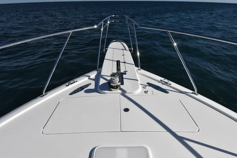 Party Of Five Yacht Photos Pics Bow view of 2019 Viking 80 Sky Bridge yacht on open sea.