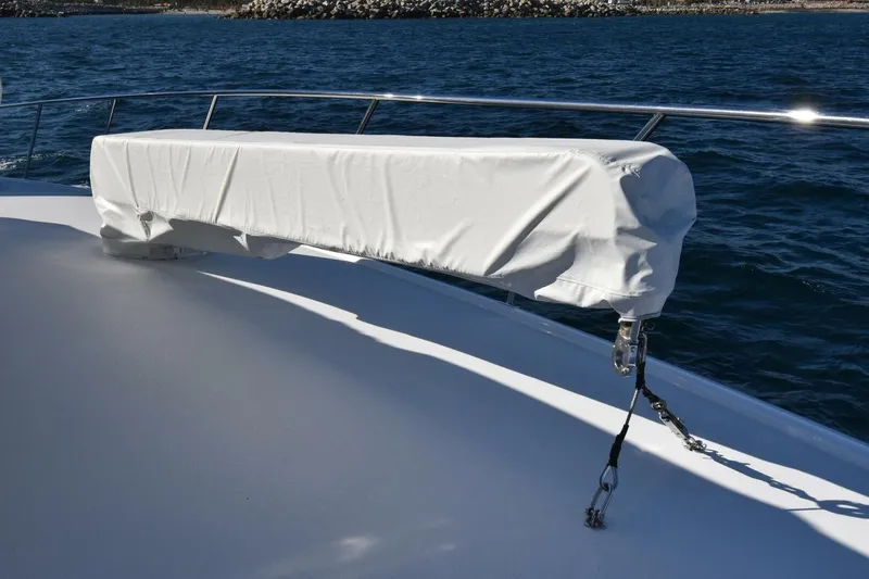 Party Of Five Yacht Photos Pics Covered equipment on 2019 Viking 80 Sky Bridge yacht deck, ocean background.