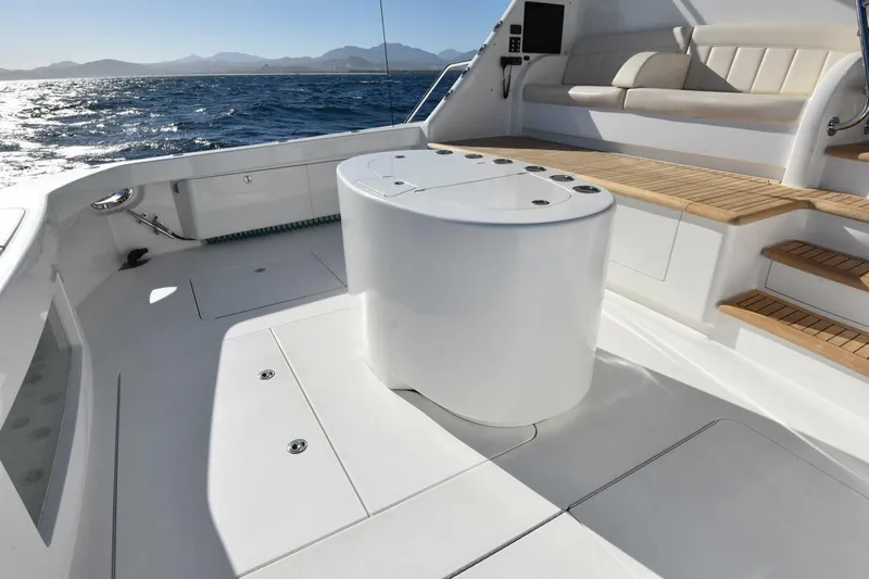 Party Of Five Yacht Photos Pics Luxurious 2019 Viking 80 Sky Bridge yacht deck with seating and ocean view.