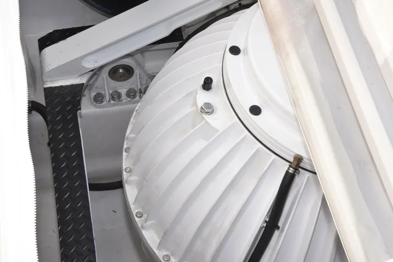 Party Of Five Yacht Photos Pics Engine compartment of 2019 Viking 80 Sky Bridge yacht, featuring mechanical components.