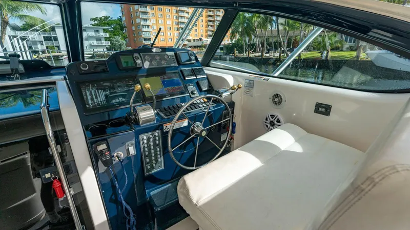 Agape Yacht Photos Pics 2007 Tiara Yachts 3800 Open helm station with modern controls and comfortable seating.