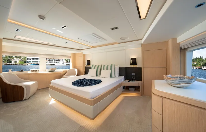Santosh Yacht Photos Pics Luxurious bedroom interior of 2020 Majesty 100 yacht with modern furnishings.