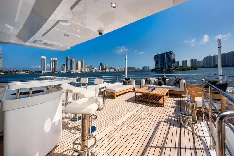 Santosh Yacht Photos Pics Luxurious deck of 2020 Majesty 100 yacht with city skyline view.