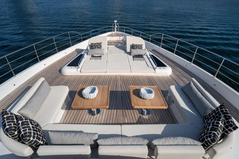 Santosh Yacht Photos Pics Luxurious deck of 2020 Majesty 100 yacht with sun loungers and seating area.