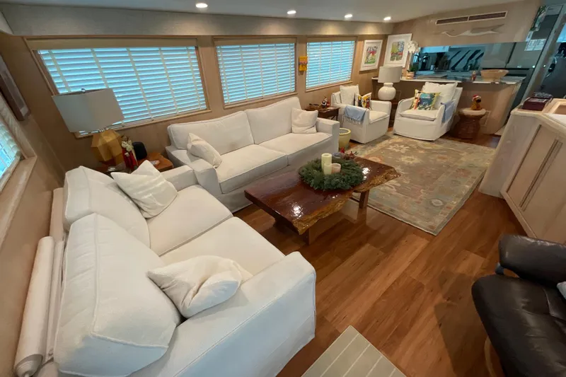 Moon River Yacht Photos Pics Luxurious interior of 1997 Hatteras 70 Sport Deck Motor Yacht with elegant furnishings.
