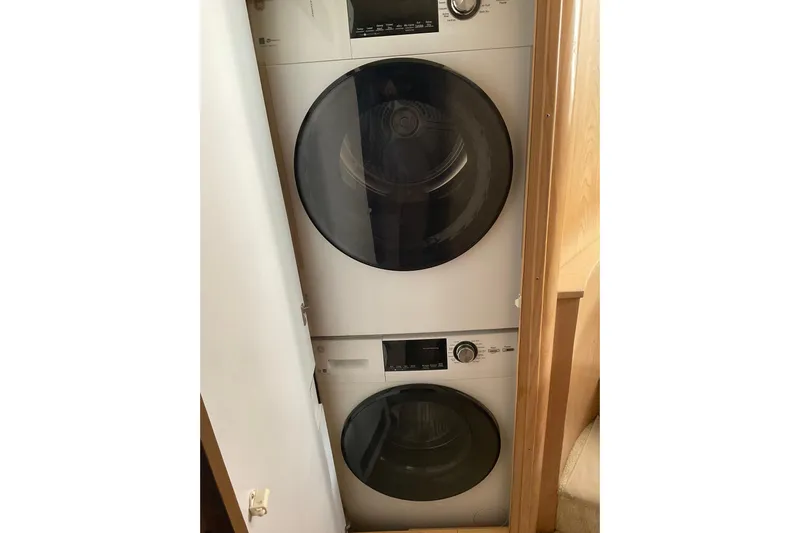 Moon River Yacht Photos Pics Stacked washer and dryer in 1997 Hatteras 70 Sport Deck Motor Yacht.