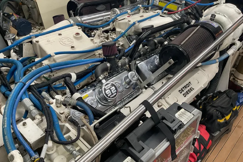 Moon River Yacht Photos Pics Engine room of 1997 Hatteras 70 Sport Deck Motor Yacht with Detroit Diesel engine.