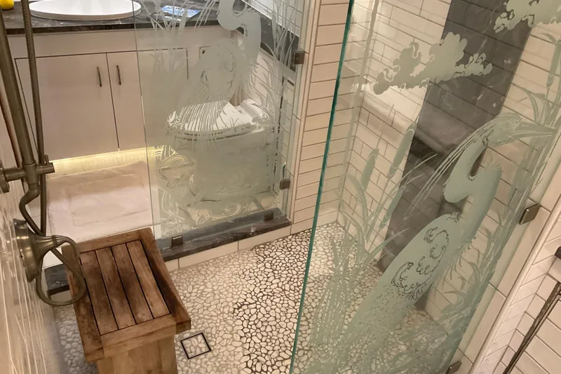 Moon River Yacht Photos Pics Luxurious bathroom in 1997 Hatteras 70 Sport Deck Motor Yacht with etched glass shower.