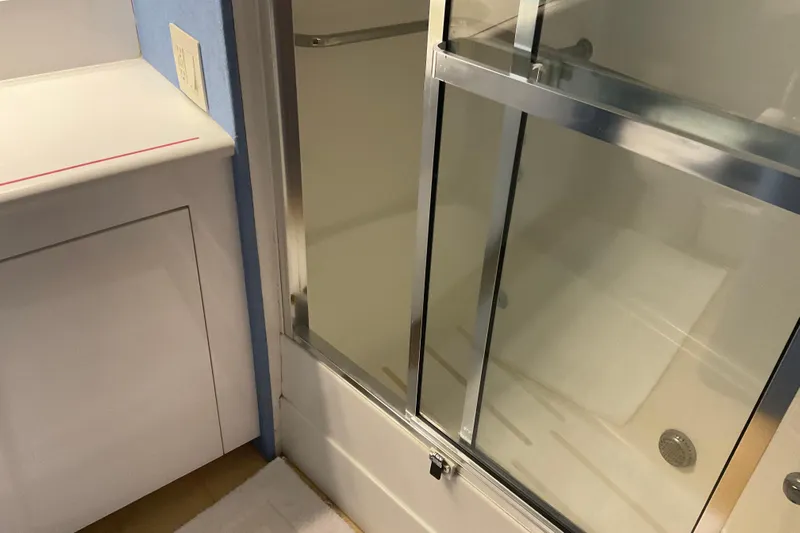 Moon River Yacht Photos Pics Shower area in 1997 Hatteras 70 Sport Deck Motor Yacht bathroom.