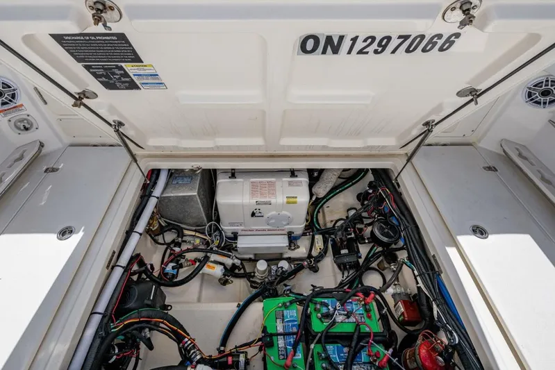  Yacht Photos Pics Engine compartment of a 2011 Boston Whaler 370 Outrage, showcasing wiring and components.