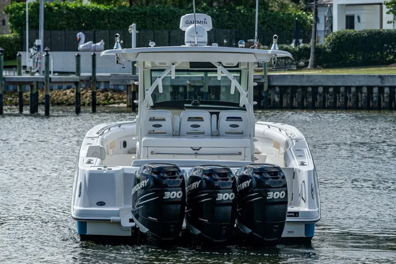 Yacht Photos Pics 2011 Boston Whaler 370 Outrage with triple Mercury 300 engines on the water.
