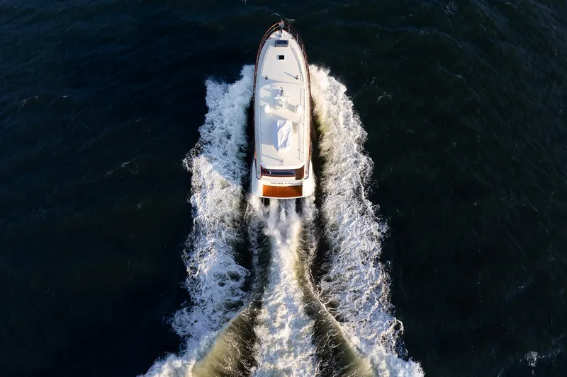 Mona Lisa Yacht Photos Pics Aerial view of 2025 Vicem 58 Classic yacht cruising through ocean waves.