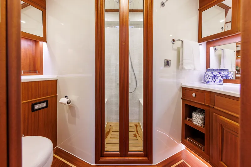 Mona Lisa Yacht Photos Pics Luxurious bathroom in 2025 Vicem 58 Classic yacht with elegant wood finishes.