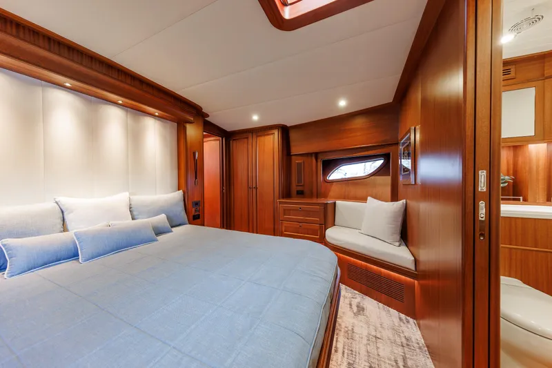 Mona Lisa Yacht Photos Pics Luxurious cabin interior of 2025 Vicem 58 Classic yacht with elegant wood finishes.