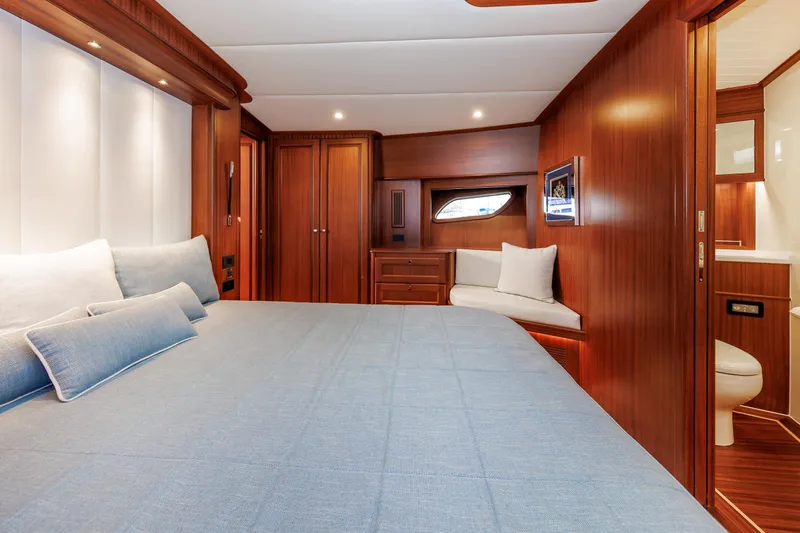 Mona Lisa Yacht Photos Pics Luxurious cabin interior of 2025 Vicem 58 Classic yacht with elegant wood finish.
