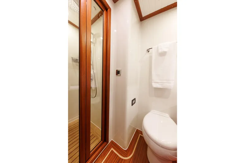 Mona Lisa Yacht Photos Pics Bathroom interior of 2025 Vicem 58 Classic yacht, featuring wood accents and modern fixtures.