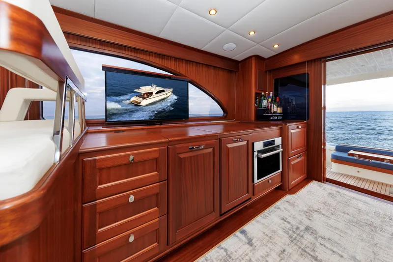 Mona Lisa Yacht Photos Pics Luxurious interior of 2025 Vicem 58 Classic yacht with wood cabinetry and ocean view.