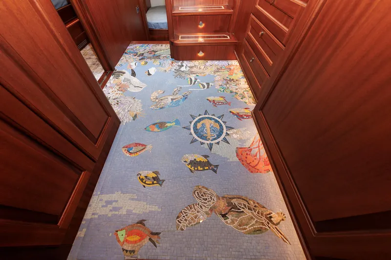 Mona Lisa Yacht Photos Pics Luxurious 2025 Vicem 58 Classic yacht interior with intricate marine-themed mosaic floor.
