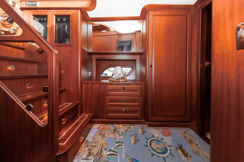 Mona Lisa Yacht Photos Pics Luxurious wood interior of 2025 Vicem 58 Classic yacht with elegant staircase and cabinetry.