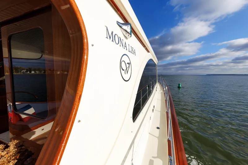 Mona Lisa Yacht Photos Pics 2025 Vicem 58 Classic yacht "Mona Lisa" cruising on open water under blue skies.