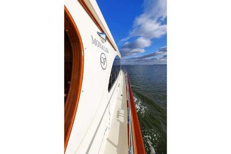Mona Lisa Yacht Photos Pics 2025 Vicem 58 Classic yacht cruising on open water under a blue sky.