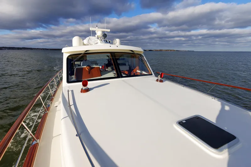 Mona Lisa Yacht Photos Pics 2025 Vicem 58 Classic yacht cruising on open water under cloudy skies.