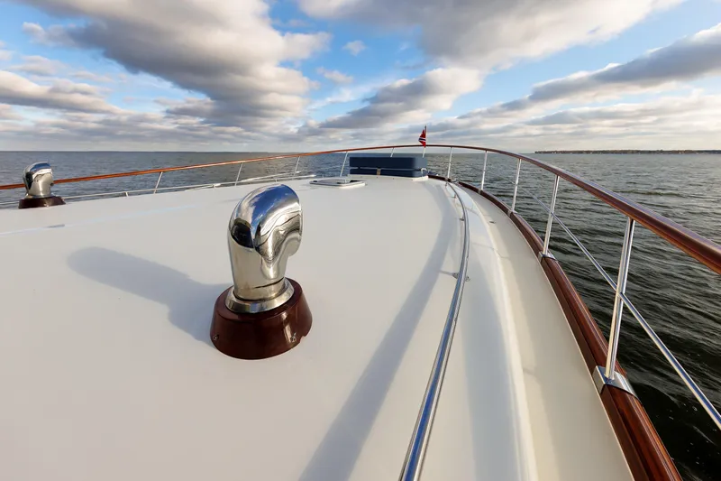 Mona Lisa Yacht Photos Pics 2025 Vicem 58 Classic yacht deck with ocean view and cloudy sky.