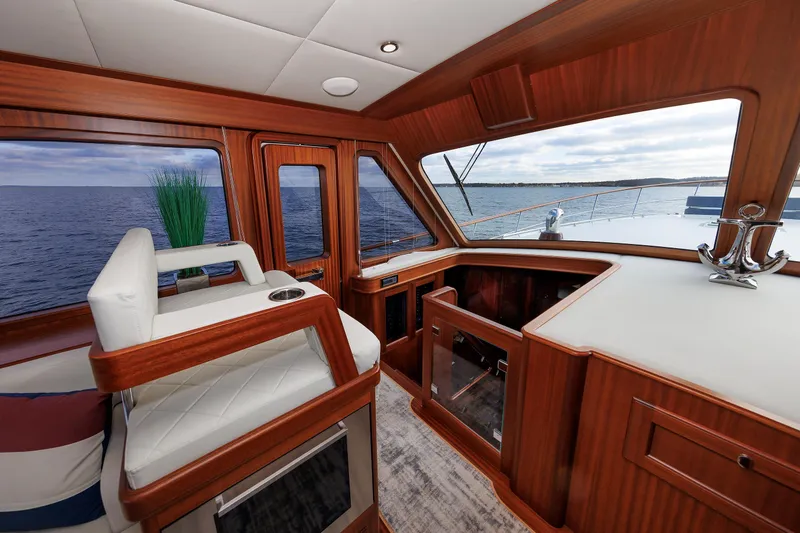 Mona Lisa Yacht Photos Pics Luxurious interior of 2025 Vicem 58 Classic yacht with elegant wood finish and ocean view.