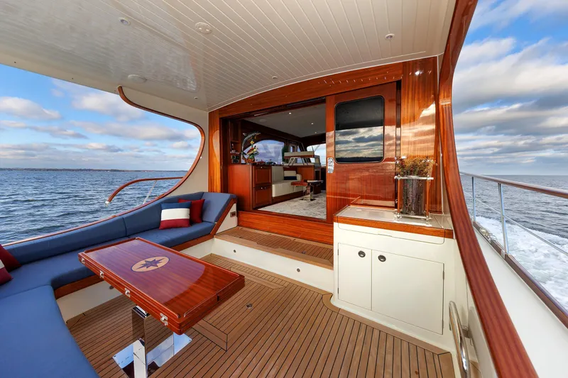 Mona Lisa Yacht Photos Pics 2025 Vicem 58 Classic yacht with elegant wooden interior and ocean view.