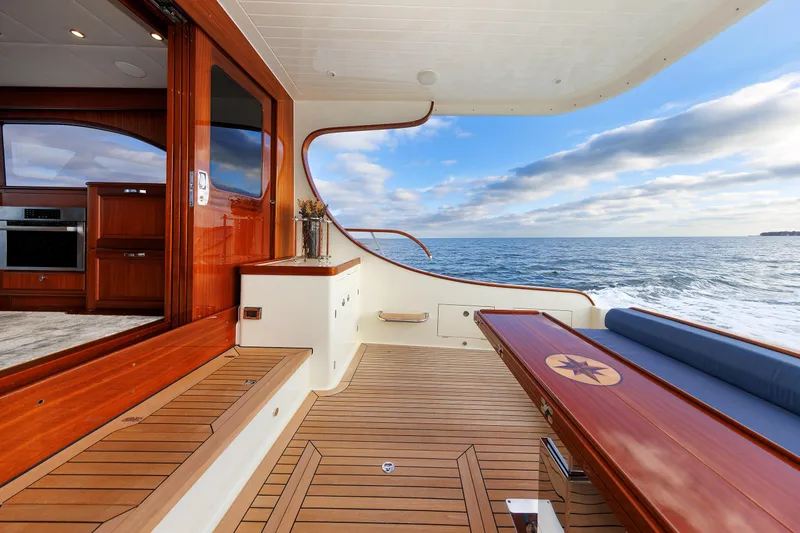 Mona Lisa Yacht Photos Pics Luxurious 2025 Vicem 58 Classic yacht interior with ocean view and elegant wood finishes.