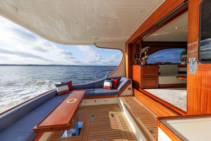 Mona Lisa Yacht Photos Pics Luxurious 2025 Vicem 58 Classic yacht interior with elegant wood finish and ocean view.