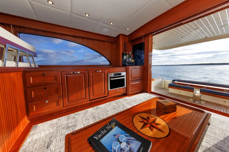 Mona Lisa Yacht Photos Pics Luxurious interior of 2025 Vicem 58 Classic yacht with wooden cabinetry and ocean view.