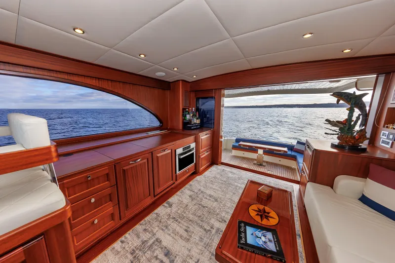 Mona Lisa Yacht Photos Pics Luxurious interior of 2025 Vicem 58 Classic yacht with ocean view and elegant wood finishes.