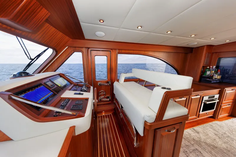 Mona Lisa Yacht Photos Pics Luxurious interior of 2025 Vicem 58 Classic yacht with elegant wood finish and modern navigation.