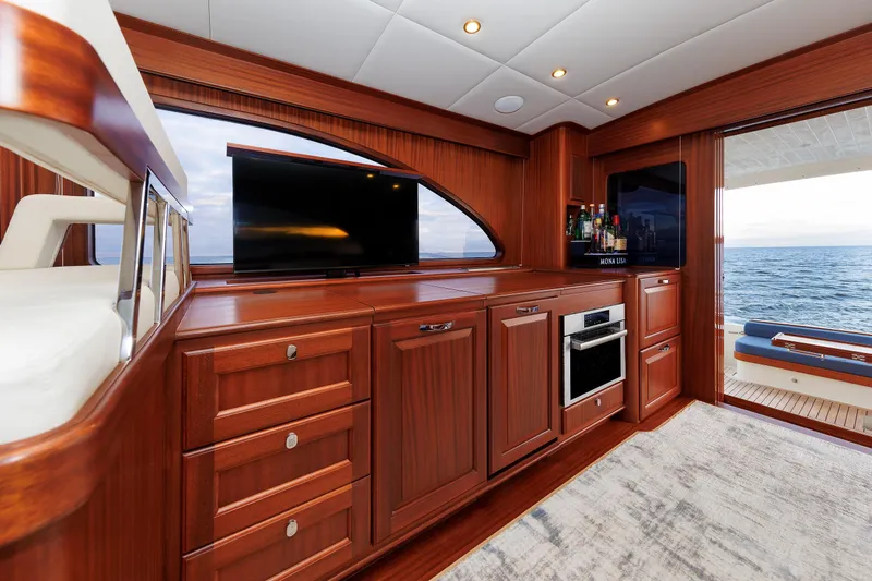 Mona Lisa Yacht Photos Pics Luxurious interior of 2025 Vicem 58 Classic yacht with wood cabinetry and ocean view.