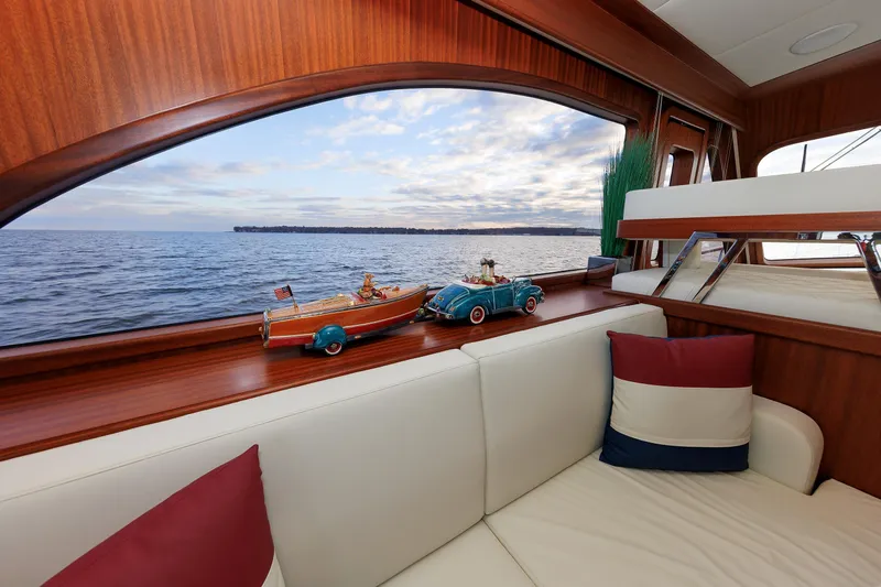 Mona Lisa Yacht Photos Pics Luxurious interior of 2025 Vicem 58 Classic yacht with ocean view and decorative models.