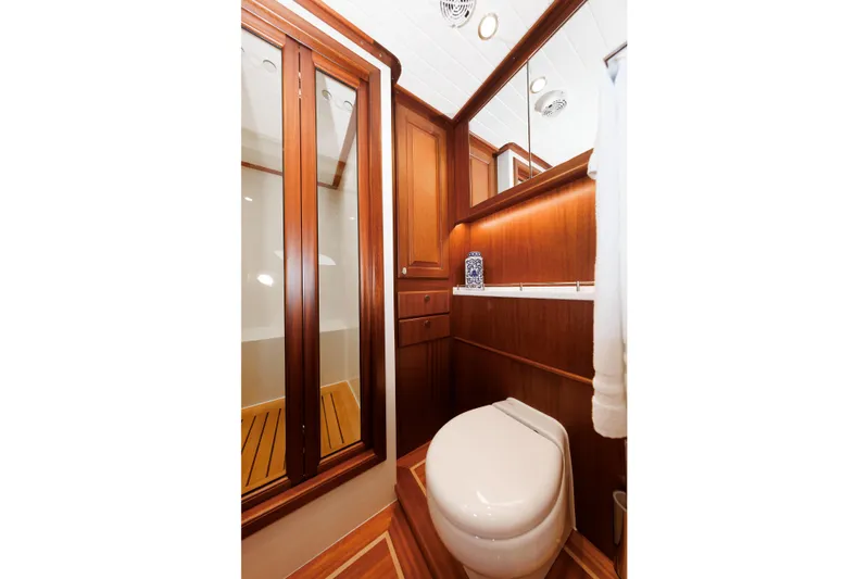 Mona Lisa Yacht Photos Pics Luxurious bathroom interior of 2025 Vicem 58 Classic yacht with wooden finishes.