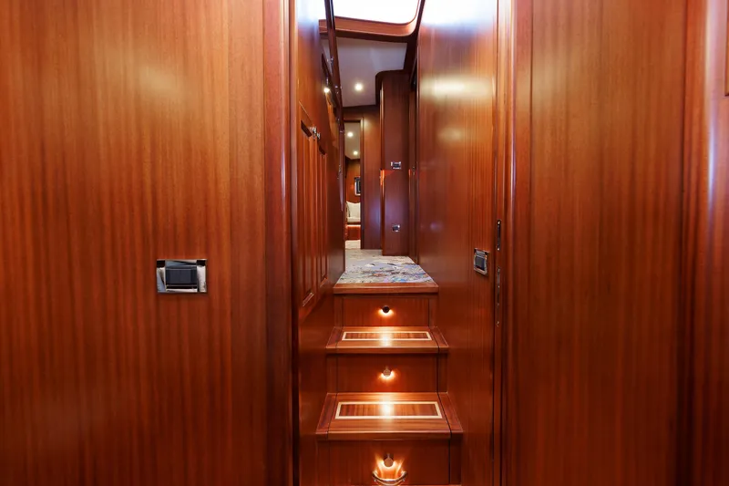 Mona Lisa Yacht Photos Pics Interior of 2025 Vicem 58 Classic yacht with wooden stairs and elegant lighting.