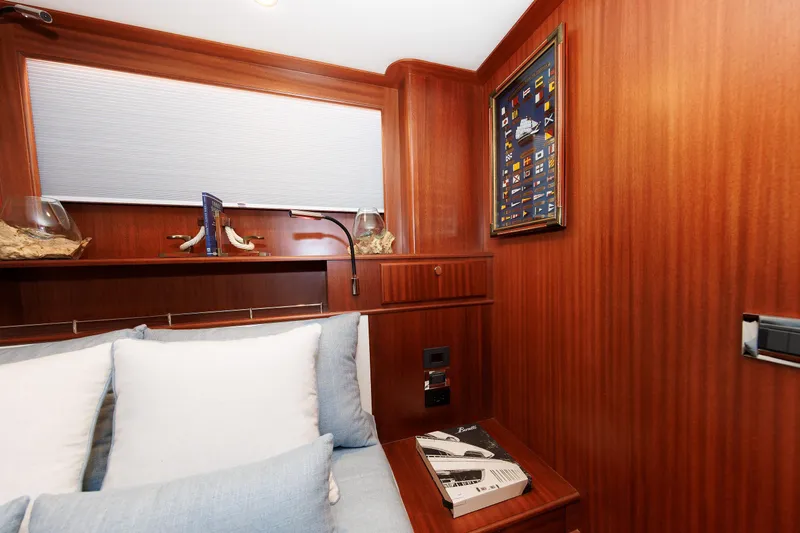 Mona Lisa Yacht Photos Pics Luxurious interior of 2025 Vicem 58 Classic yacht with elegant wood paneling and cozy seating.