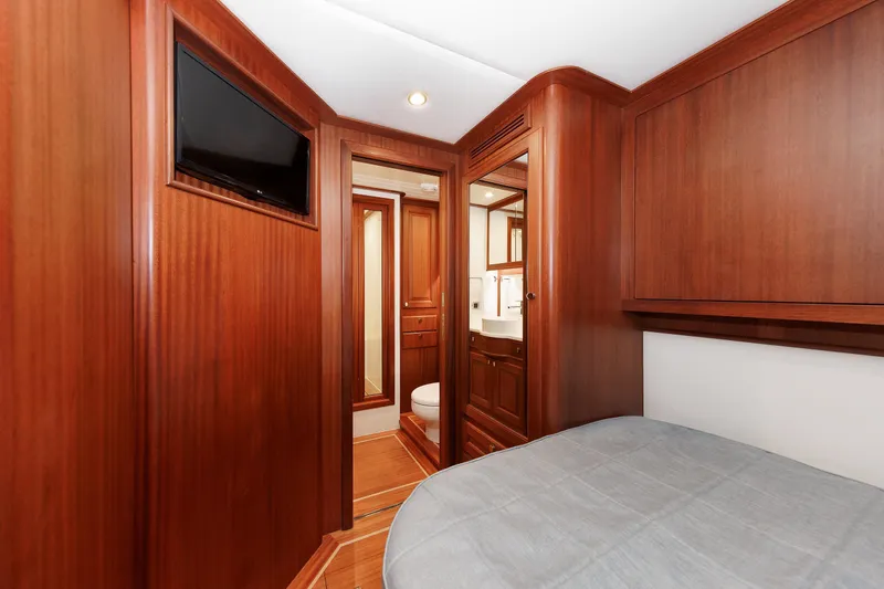 Mona Lisa Yacht Photos Pics Luxurious wood interior of 2025 Vicem 58 Classic yacht cabin with TV and ensuite bathroom.