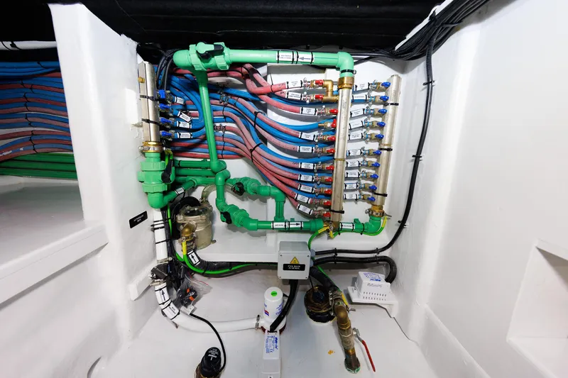Mona Lisa Yacht Photos Pics Engine room piping system of 2025 Vicem 58 Classic yacht, featuring organized colored tubes.