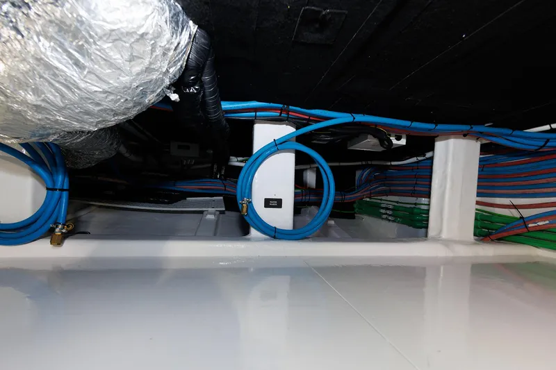 Mona Lisa Yacht Photos Pics Engine room wiring of 2025 Vicem 58 Classic yacht, showcasing organized cables and ducts.